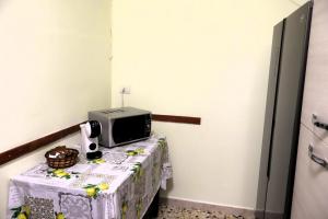 a table with a television on top of it at A due passi dal mare in Portovenere