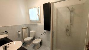 a bathroom with a toilet and a sink and a shower at A due passi dal mare in Portovenere +9 photos
