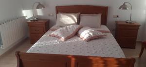 A bed or beds in a room at Hostal Casa Martinez