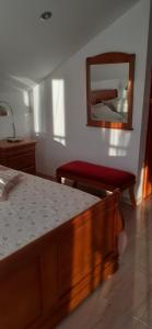 A bed or beds in a room at Hostal Casa Martinez