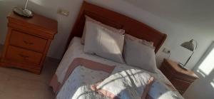 A bed or beds in a room at Hostal Casa Martinez