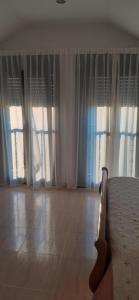 A bed or beds in a room at Hostal Casa Martinez