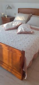 A bed or beds in a room at Hostal Casa Martinez