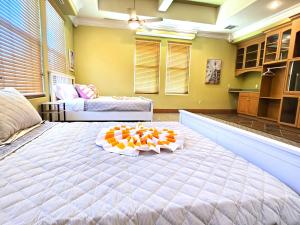 a large bedroom with a large bed with a tray on it at Stars Manor-Disney-Universal-Pool-22people in Kissimmee +80 photos