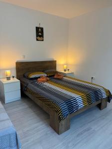 Postel nebo postele na pokoji v ubytování Apartman Laura