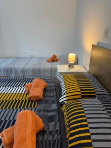 Postel nebo postele na pokoji v ubytování Apartman Laura