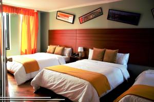 Postel nebo postele na pokoji v ubytování HOTEL MADURAI