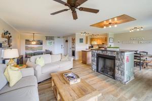 a living room with a couch and a fireplace at Banner Elk Mountain-View Condo 3 Mi to Skiing! in Banner Elk