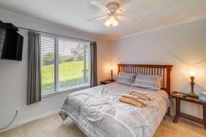 a bedroom with a bed with a ceiling fan and a window at Banner Elk Mountain-View Condo 3 Mi to Skiing! in Banner Elk