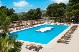 an overhead view of a swimming pool with lounge chairs at Dream Escape Mobile Home in Vodice
