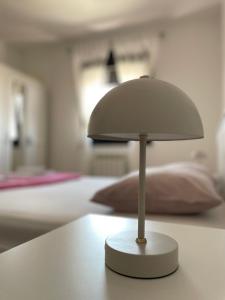 En eller flere senge i et værelse på Apartman Luni