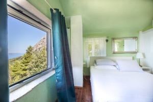 Postel nebo postele na pokoji v ubytování Holiday Home Dalmatinska Kuća