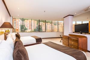 Postel nebo postele na pokoji v ubytování Hotel Bogotá Regency Usaquén + 37 fotografií