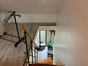 a view of a room with a camera on a tripod at Appartement Cosy JO proche Paris mobilité travail in Deuil-la-Barre