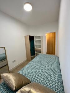 Ένα ή περισσότερα κρεβάτια σε δωμάτιο στο Piso céntrico helicóptero