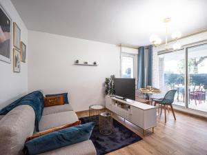 Μια τηλεόραση ή/και κέντρο ψυχαγωγίας στο Appartement cocooning en centre-ville - Résidence le Colisée