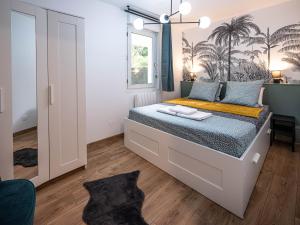 Ένα ή περισσότερα κρεβάτια σε δωμάτιο στο Appartement cocooning en centre-ville - Résidence le Colisée