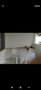 a room with a table and two chairs and a table and a table and chairs at Flor de Lis in Salvador
