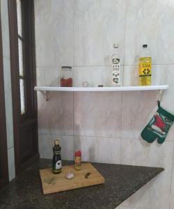 a bathroom with a wooden cutting board on a counter at Flor de Lis in Salvador