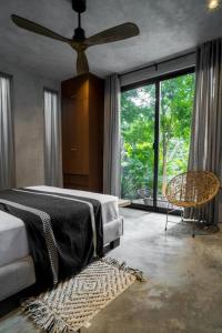Katil atau katil-katil dalam bilik di Experiencia natural única Tulum