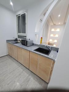Kuchyň nebo kuchyňský kout v ubytování Appartement neuf 55 m2 + 10 fotografií