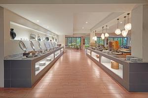 a large room with a store with dishes on display at Holiday Inn & Suites Batangas LimaPark by IHG in Batangas City
