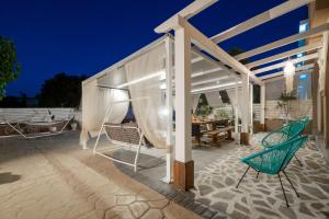 A patio or other outdoor area at Casa D'Oro Exclusive Villa