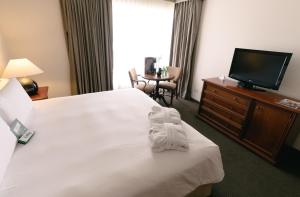 Postel nebo postele na pokoji v ubytování BTH Hotel Lima Golf