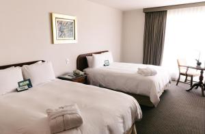 Postel nebo postele na pokoji v ubytování BTH Hotel Lima Golf
