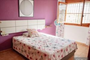 Giường trong phòng chung tại Villa Rosal