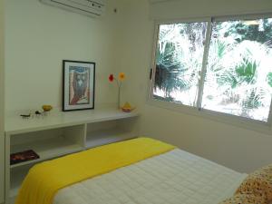 Cama ou camas em um quarto em Casa Estrela do Mar