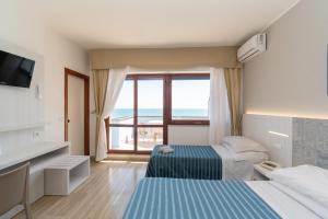 Postel nebo postele na pokoji v ubytování Hotel Galf + 37 fotografií