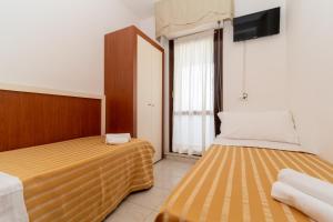 Postel nebo postele na pokoji v ubytování Hotel Galf