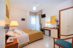 Postel nebo postele na pokoji v ubytování Hotel Galf