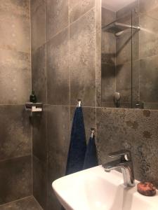 a bathroom with a sink and a mirror at Stara Praga in Warsaw