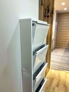 a white refrigerator with its doors open in a room at Muzdeniz Life in Gazipasa