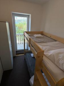 Postel nebo postele na pokoji v ubytování Apartments Prosika