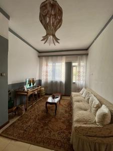 a living room with a large couch and a table at Casa Tota in Assomada +90 photos