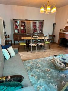 a living room with a couch and a table at Casa Acquaviva in Acquaviva Collecroce