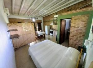 a bedroom with a white bed in a room at El Descanso en San Rafael in San Rafael