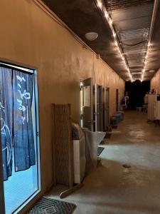 a hallway of a building with a large window at やどバンブー in Hateruma