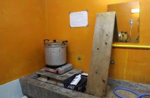 a kitchen with a pot on top of a stove at やどバンブー in Hateruma