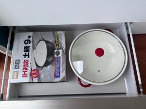 a room with a cd and a mirror on a shelf at 20C Ryukyu in Nakijin