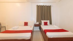 Postel nebo postele na pokoji v ubytování RedDoorz @ The Central Inn Boracay Island