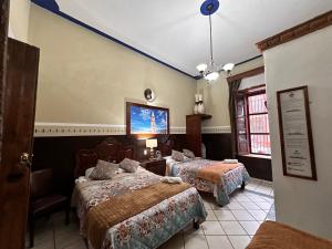 Postel nebo postele na pokoji v ubytování Copa de Oro Hotel Boutique