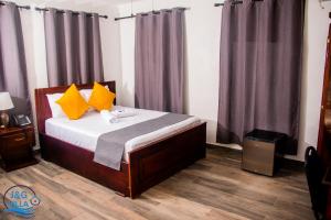 Postel nebo postele na pokoji v ubytování J&G Villa Hotel