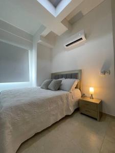 Postel nebo postele na pokoji v ubytování Lindo Apartamento con Jacuzzi en Monteria