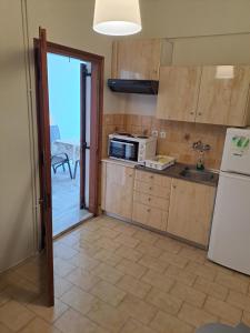 Kuchyňa alebo kuchynka v ubytovaní P.A.G Apartments