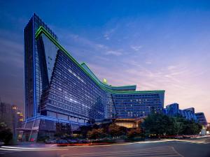 a tall building with a lot of windows in a city at Holiday Inn Chengdu Century City-WestTower in Chengdu