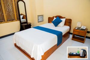 SP Tourist Hotel Jaffna客房内的一张或多张床位